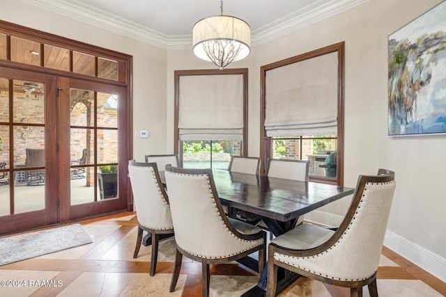 dining space featuring french doors and ornamental molding