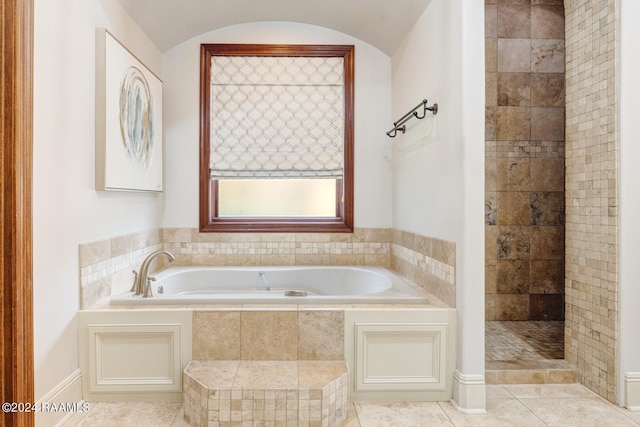 bathroom featuring tile patterned flooring and plus walk in shower