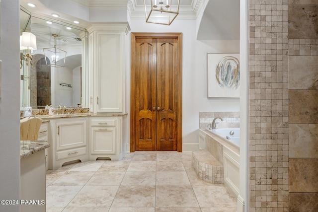 bathroom with tile patterned flooring, vanity, tiled bath, and ornamental molding