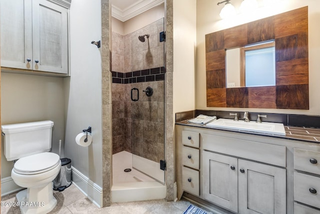 bathroom featuring vanity, toilet, a shower with shower door, and crown molding