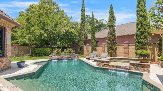 view of swimming pool featuring an in ground hot tub and pool water feature