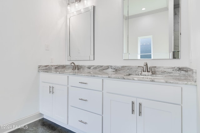 bathroom with vanity and ornamental molding