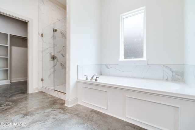 bathroom with plus walk in shower and concrete floors