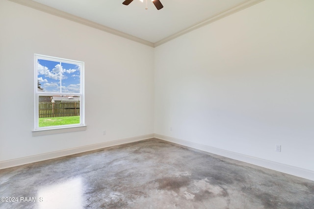 spare room with concrete floors, ceiling fan, and crown molding