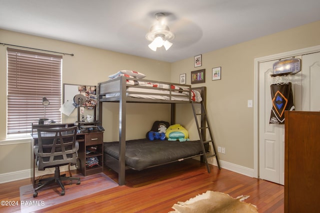 bedroom featuring ceiling fan and hardwood / wood-style flooring