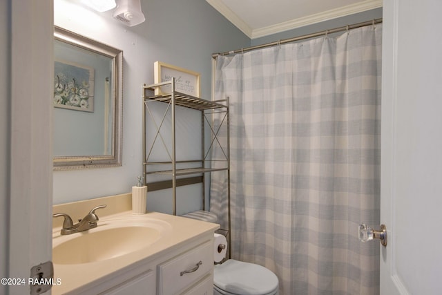 bathroom featuring crown molding, vanity, and toilet