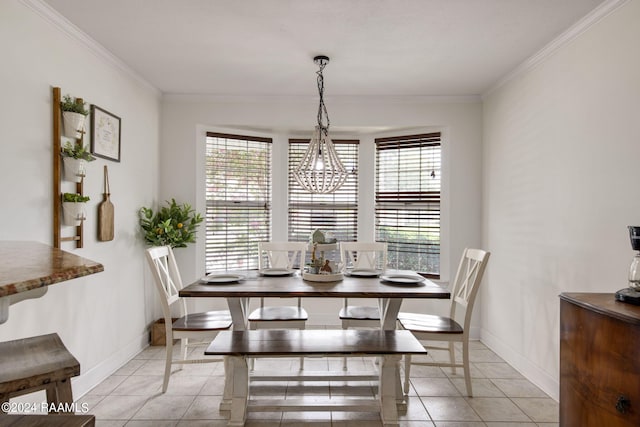 dining room with light tile patterned flooring, a healthy amount of sunlight, and ornamental molding