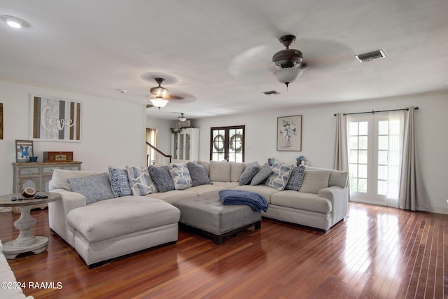 living room featuring french doors, hardwood / wood-style floors, and ceiling fan