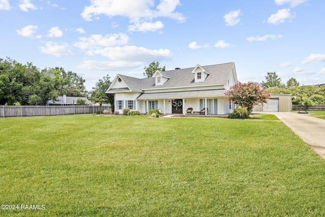 view of front of home featuring a garage and a front lawn