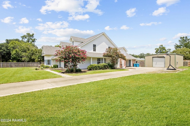 view of front of property with a garage and a front yard