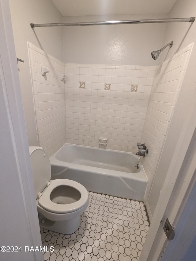 bathroom with toilet and shower / bath combination