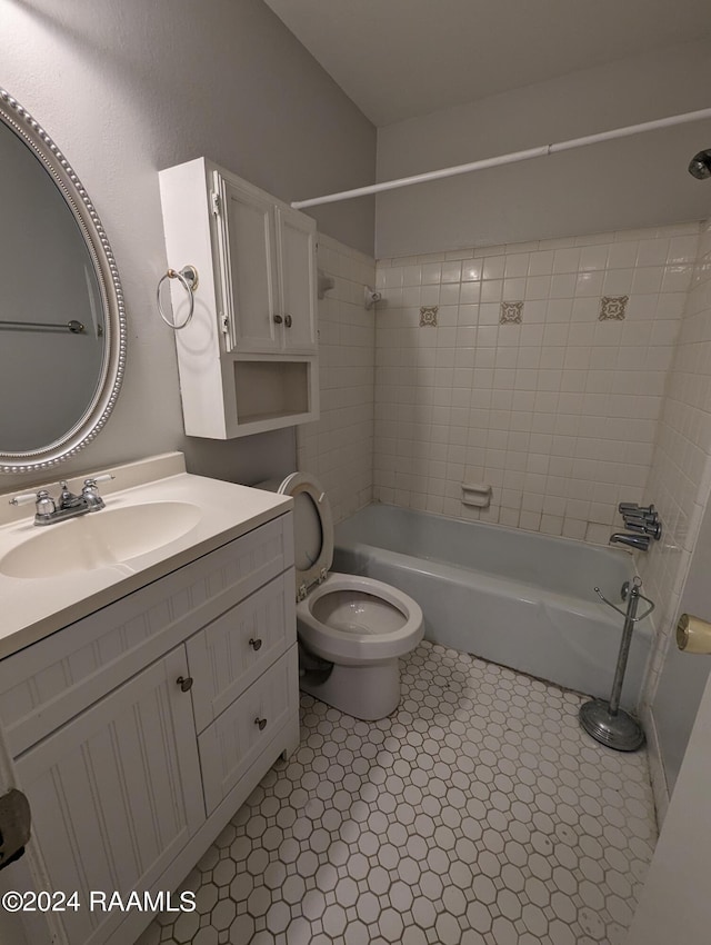 full bath featuring toilet,  shower combination, and vanity