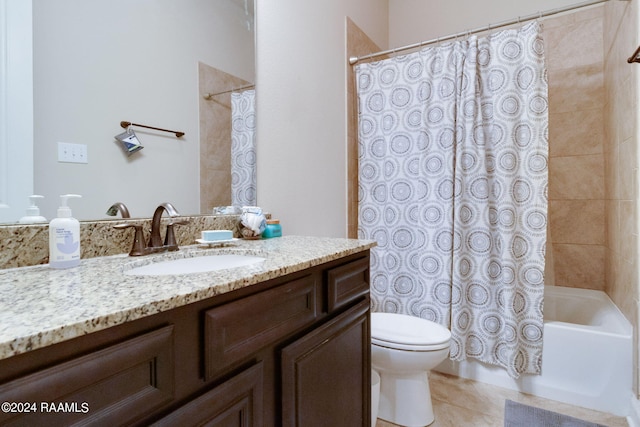 full bathroom with tile patterned flooring, vanity, shower / tub combo with curtain, and toilet