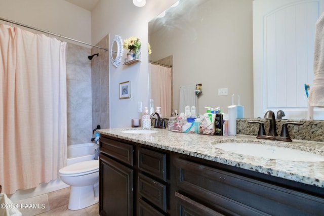 full bathroom with tile patterned floors, vanity, toilet, and shower / tub combo