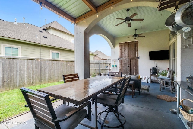 view of patio featuring ceiling fan