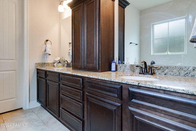 bathroom featuring tile patterned floors and vanity