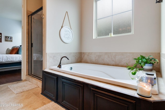 bathroom with plus walk in shower and tile patterned floors