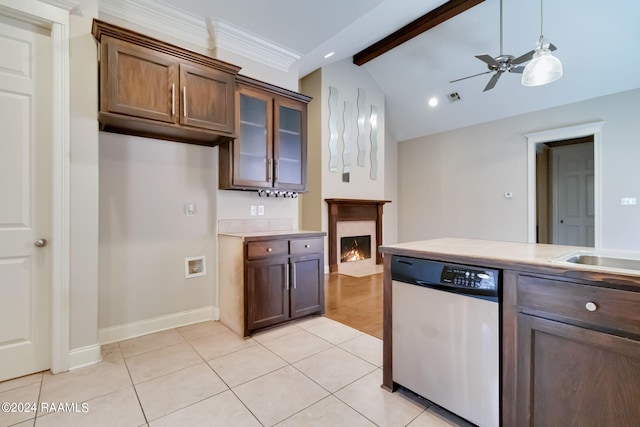 kitchen with dark brown cabinetry, ceiling fan, light tile patterned floors, dishwasher, and vaulted ceiling with beams