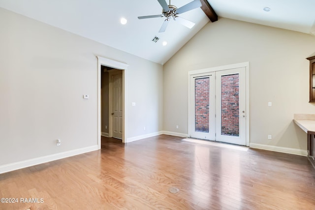 unfurnished living room with ceiling fan, light hardwood / wood-style flooring, and lofted ceiling with beams