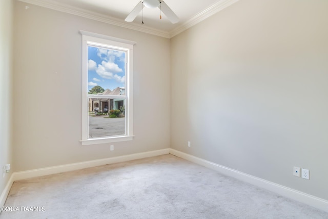 empty room with light carpet, ceiling fan, and ornamental molding