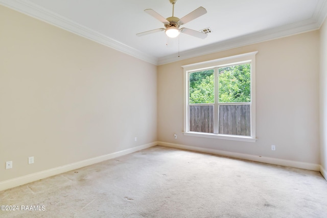 unfurnished room featuring light carpet, ceiling fan, and ornamental molding