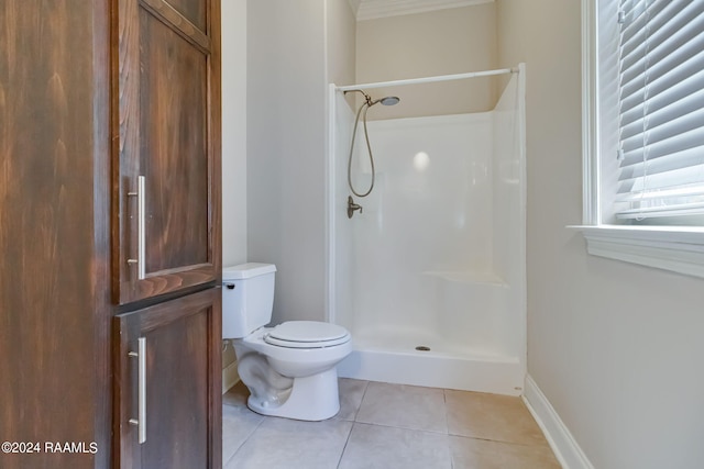 bathroom with toilet, tile patterned floors, and walk in shower