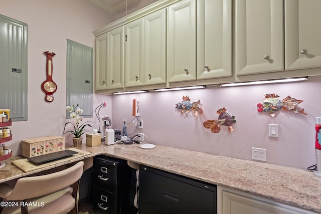 kitchen with electric panel, crown molding, and light stone countertops