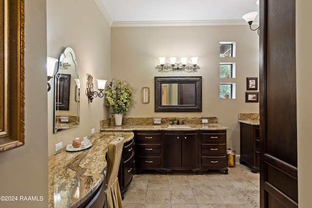 bathroom featuring vanity and ornamental molding