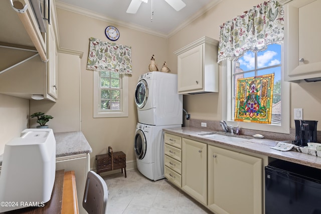 clothes washing area with stacked washer / drying machine, ceiling fan, crown molding, and sink