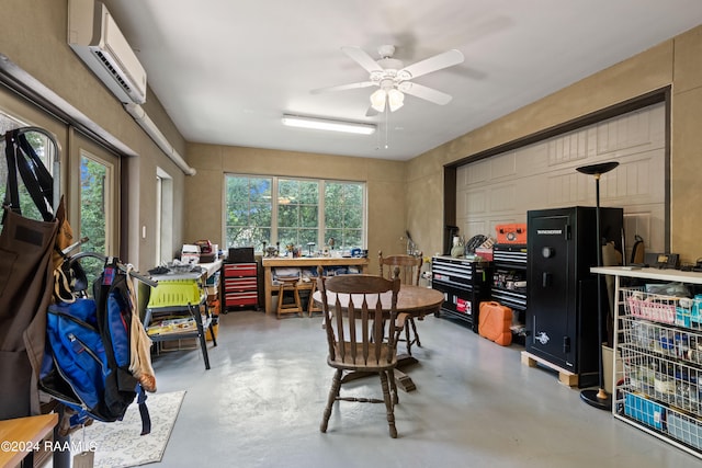 interior space with ceiling fan, an AC wall unit, and concrete flooring