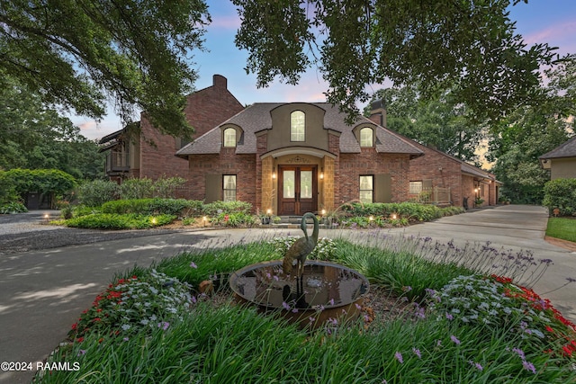 french provincial home with french doors