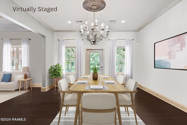 dining space with crown molding, a healthy amount of sunlight, and light hardwood / wood-style floors