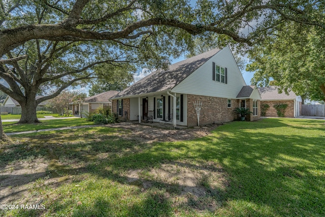 rear view of house featuring a lawn