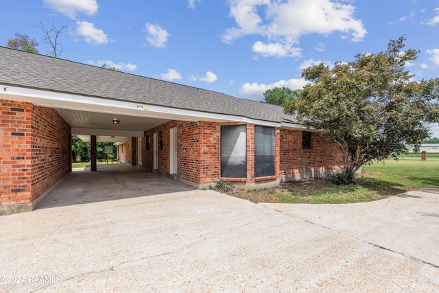 view of side of home featuring a carport