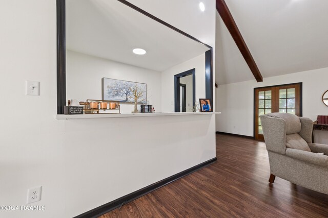 interior space with dark hardwood / wood-style floors, lofted ceiling with beams, and french doors