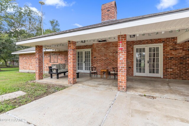 view of patio / terrace featuring french doors