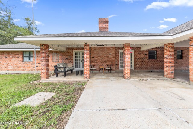 rear view of house with a patio