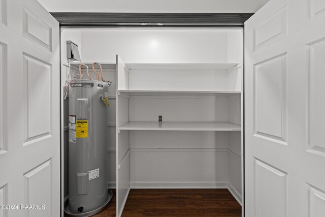 utility room with electric water heater