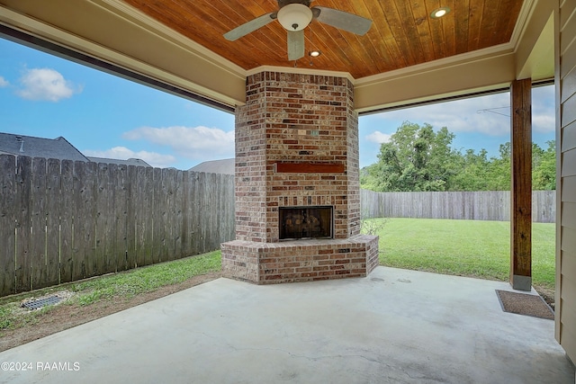 view of patio featuring ceiling fan and an outdoor brick fireplace