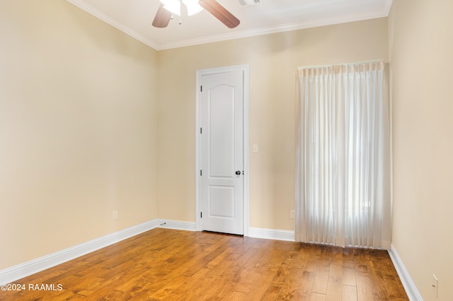 unfurnished room with light hardwood / wood-style floors, ornamental molding, and ceiling fan