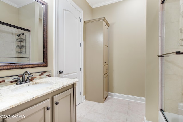 bathroom featuring vanity, crown molding, tile patterned flooring, tiled shower, and backsplash