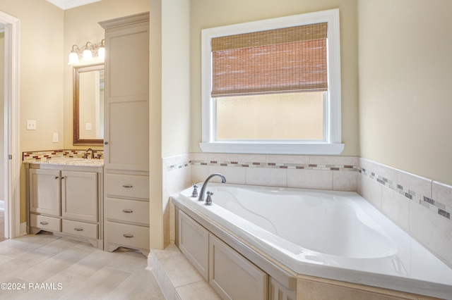 bathroom featuring a bath, tile patterned flooring, and vanity