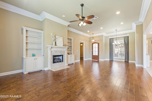 unfurnished living room with visible vents, baseboards, a premium fireplace, wood finished floors, and ceiling fan with notable chandelier