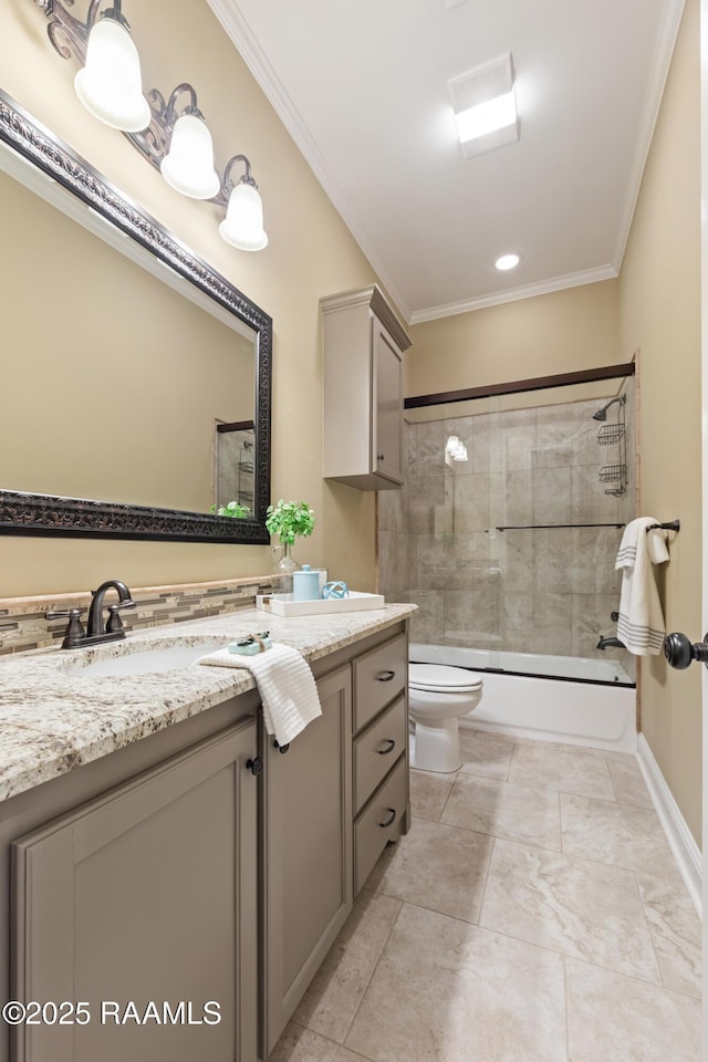 bathroom with toilet, shower / bath combination with glass door, ornamental molding, and vanity