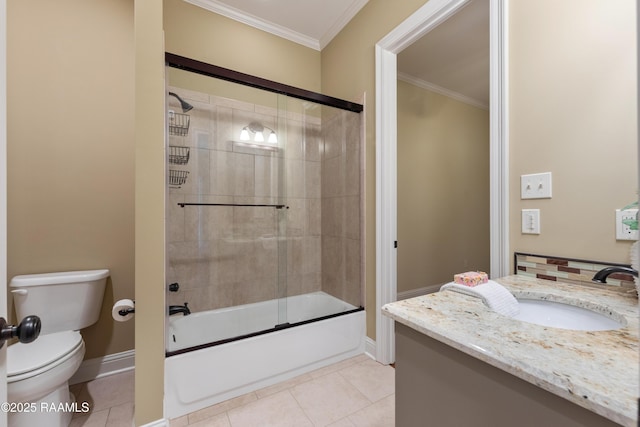 full bath with crown molding, toilet, vanity, baseboards, and tile patterned floors