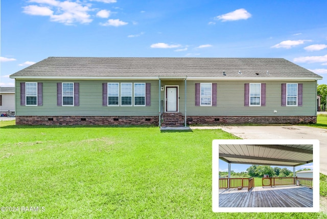 ranch-style house featuring a carport and a front yard