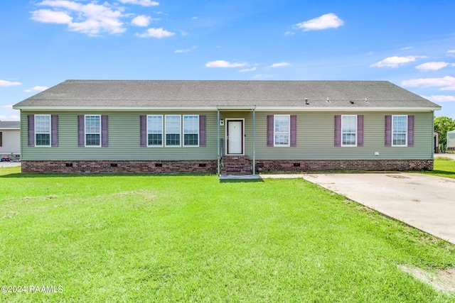 ranch-style house with a front lawn