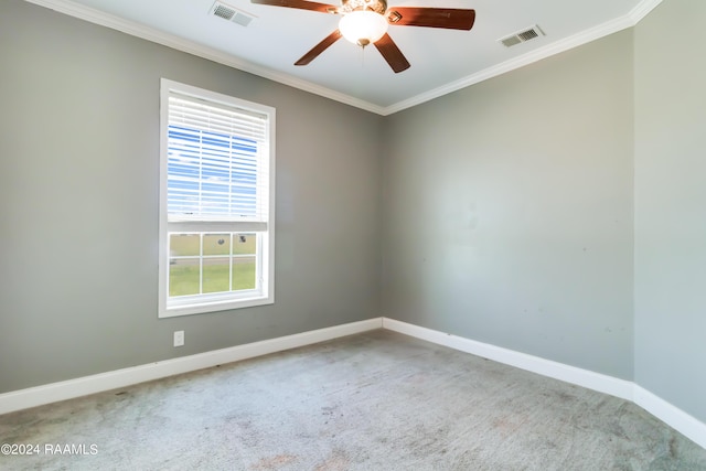 empty room with carpet flooring, ceiling fan, and ornamental molding