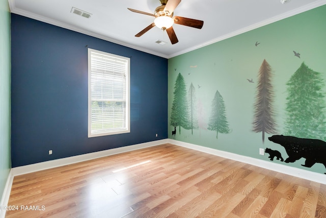 unfurnished room with light hardwood / wood-style floors, ceiling fan, and crown molding