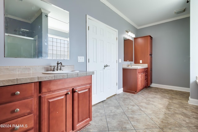 bathroom featuring tile patterned flooring, vanity, and ornamental molding